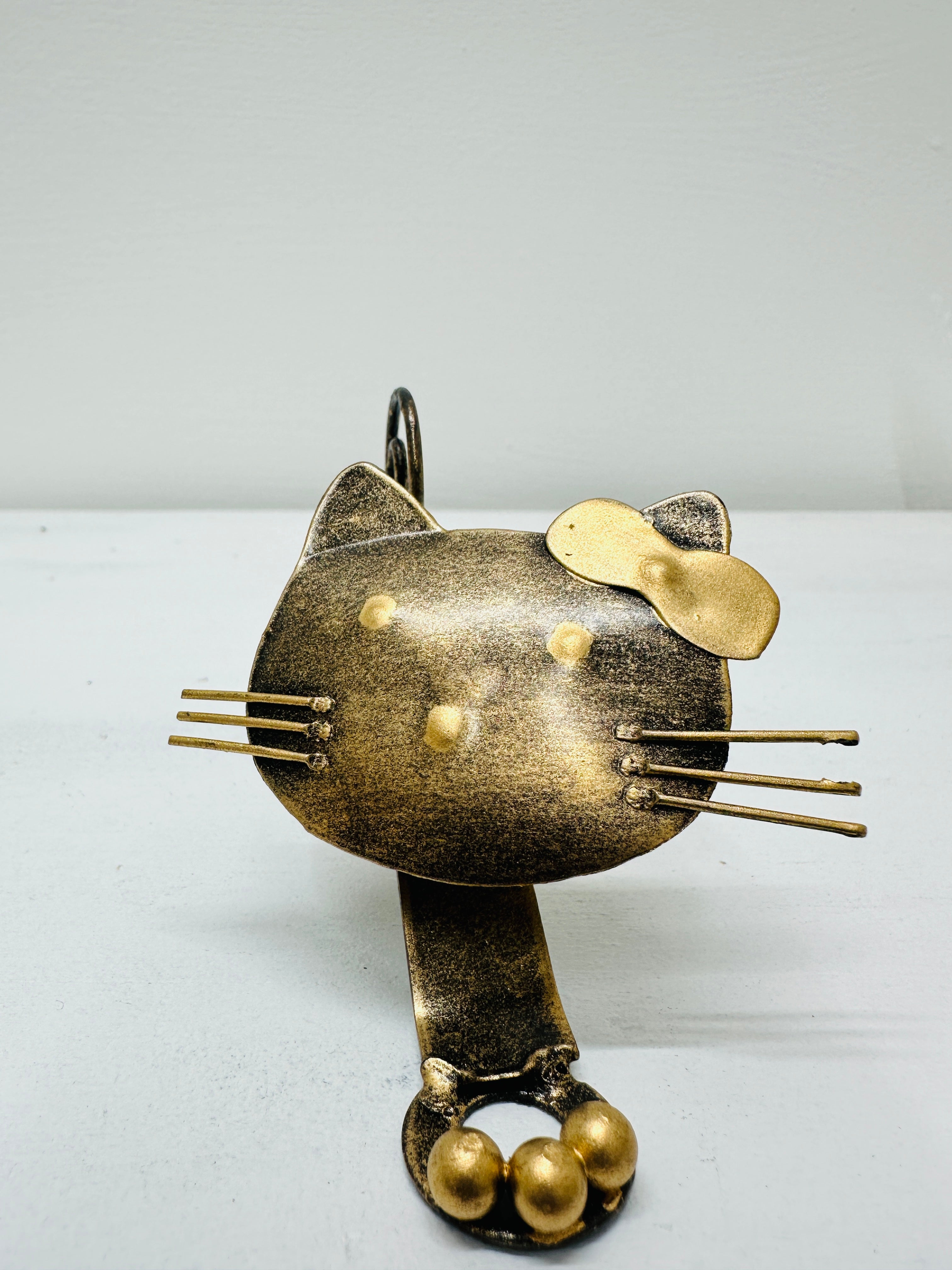 front view of metal baby kitty