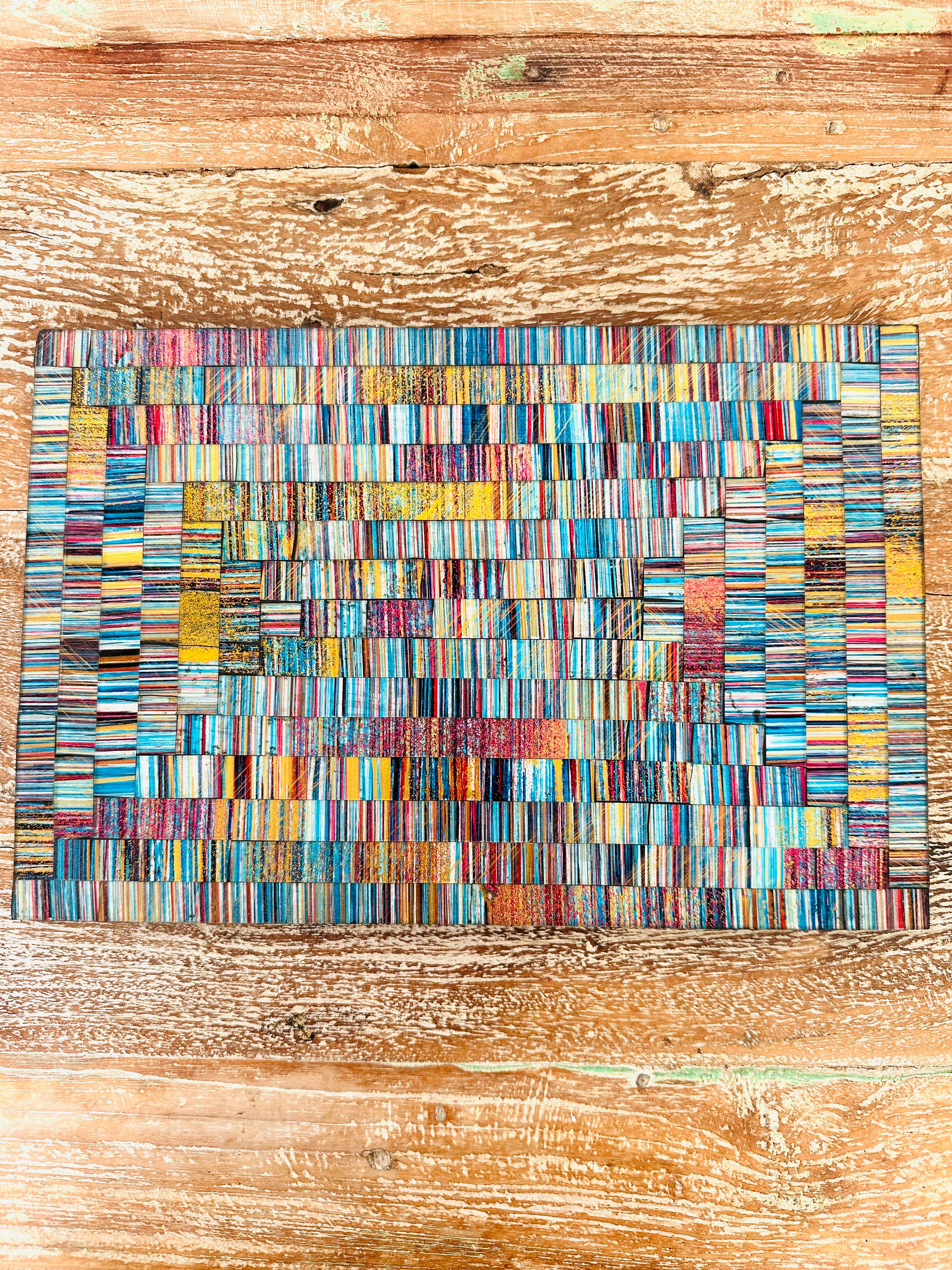 aerial view of single mosaic placemat on wooden surface