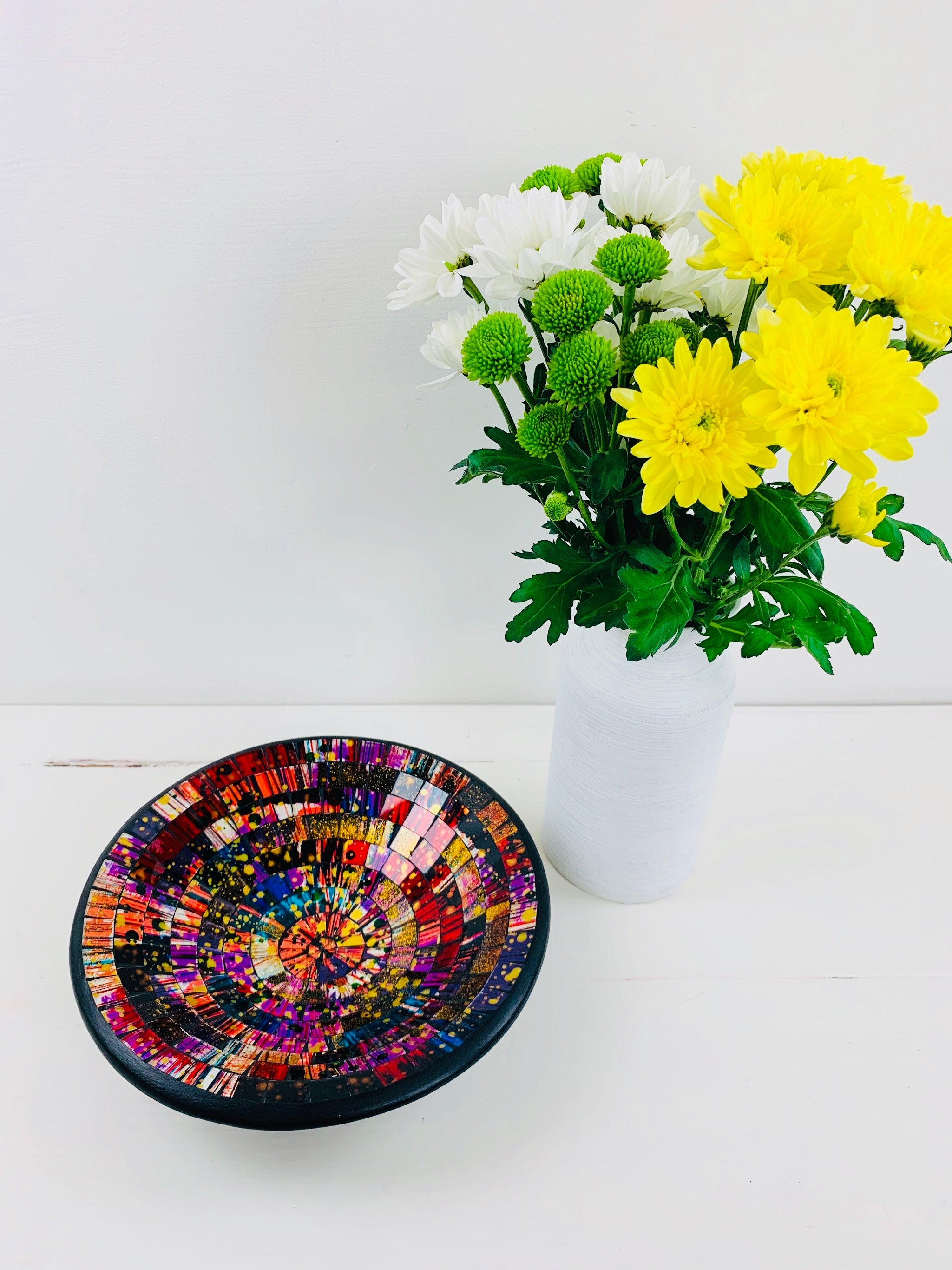 aerial view of mosaic bowl and a vase of flowers