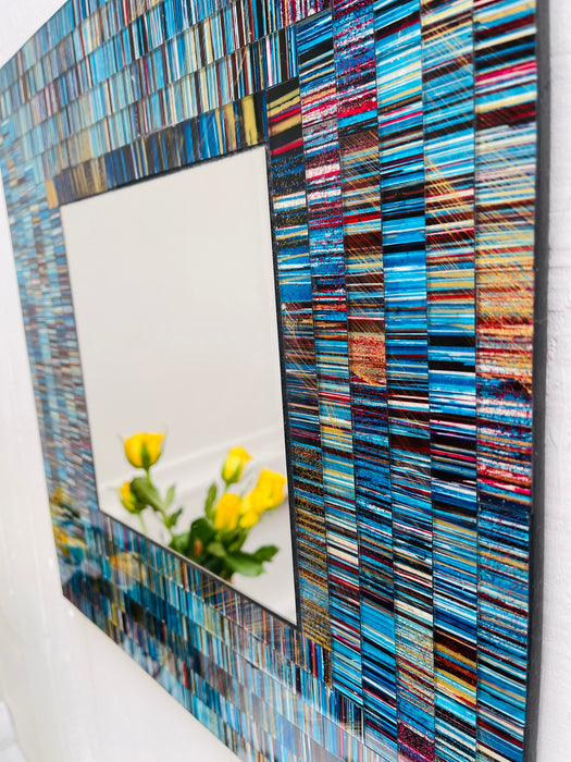 close up of mosaic square mirror in blue